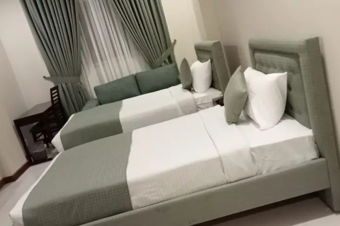 Atlas Hotel Deluxe Room Bed in Islamabad