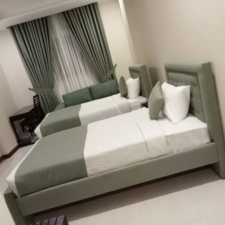 Atlas Hotel Deluxe Room Bed in Islamabad