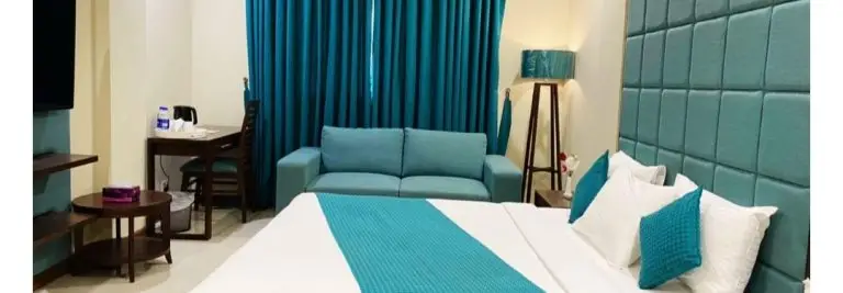 Atlas Hotel Deluxe Room Bed in Islamabad